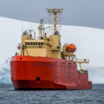 The R/V Laurence M. Gould in front of an Antarctic glacier.